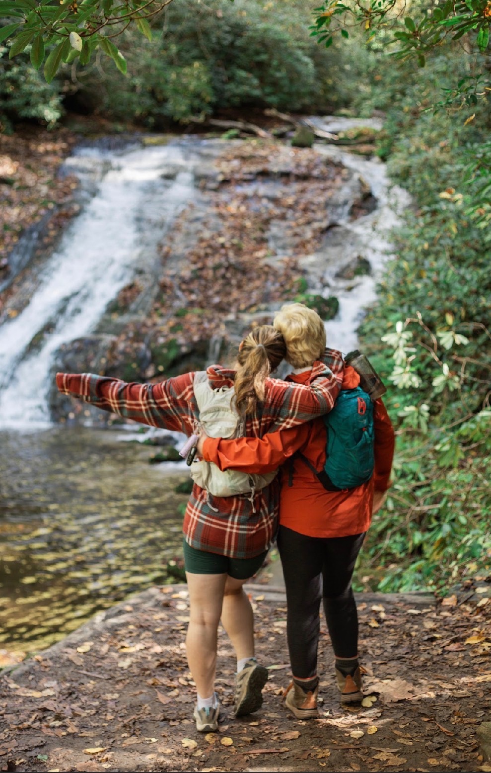 Karen and her daughter looking out at a waterfall in Western North Carolina